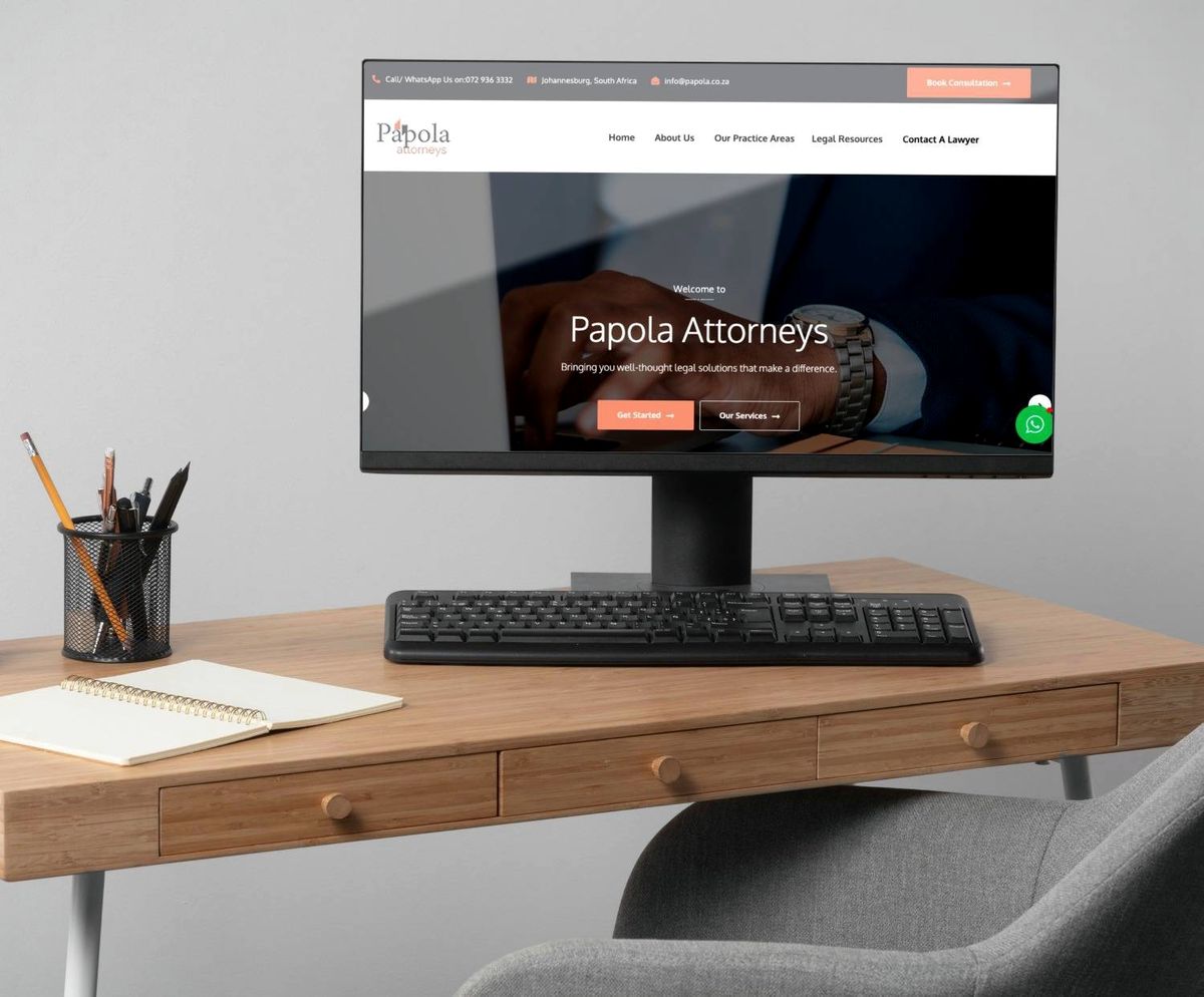 Papola Attorneys website shown on a desktop monitor