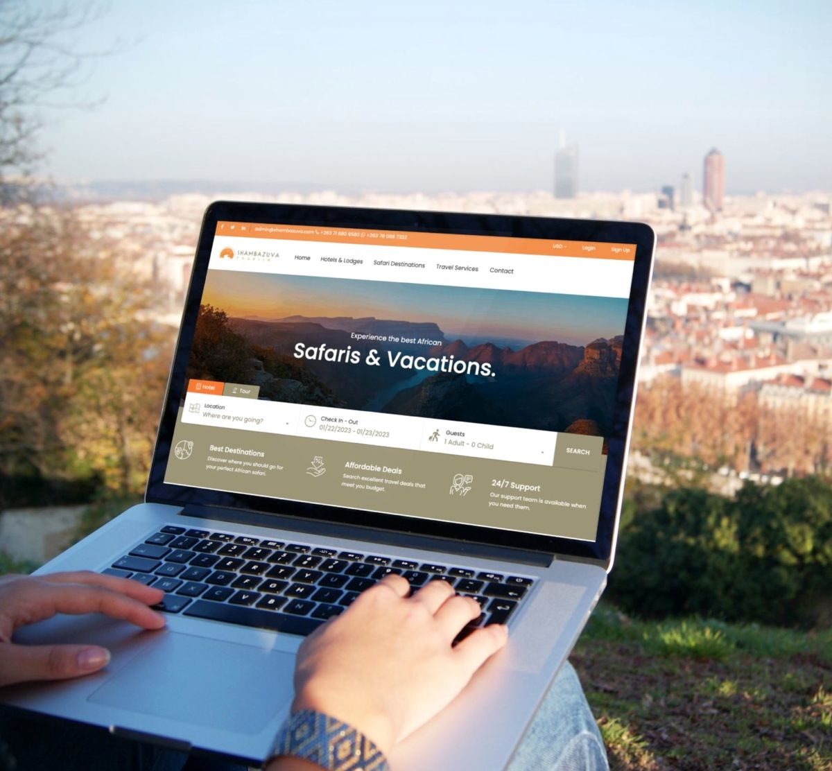 Shambazuva Tourism travel booking system shown on a laptop