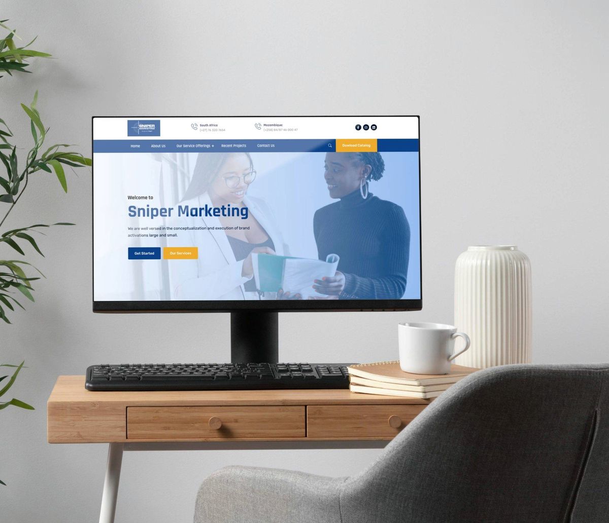 Sniper Marketing website shown on a desktop monitor